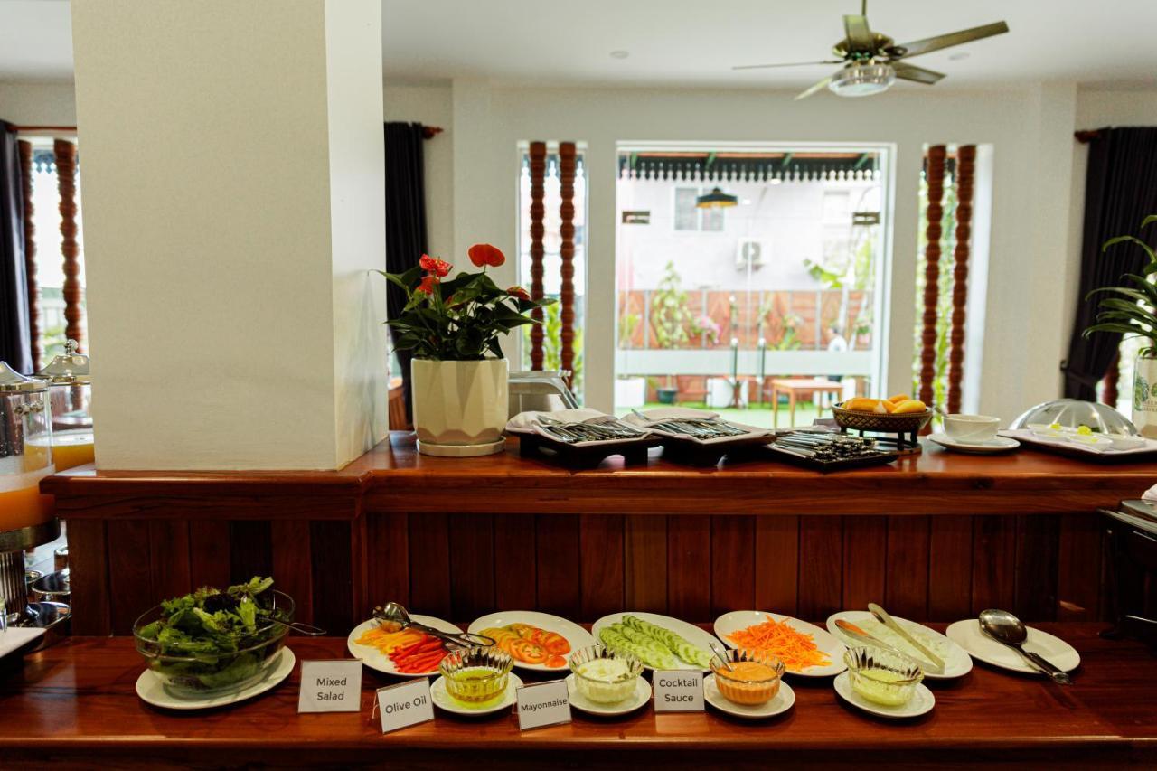 Two Seasons Siem Reap Hotel Экстерьер фото A selection of dishes at a buffet
